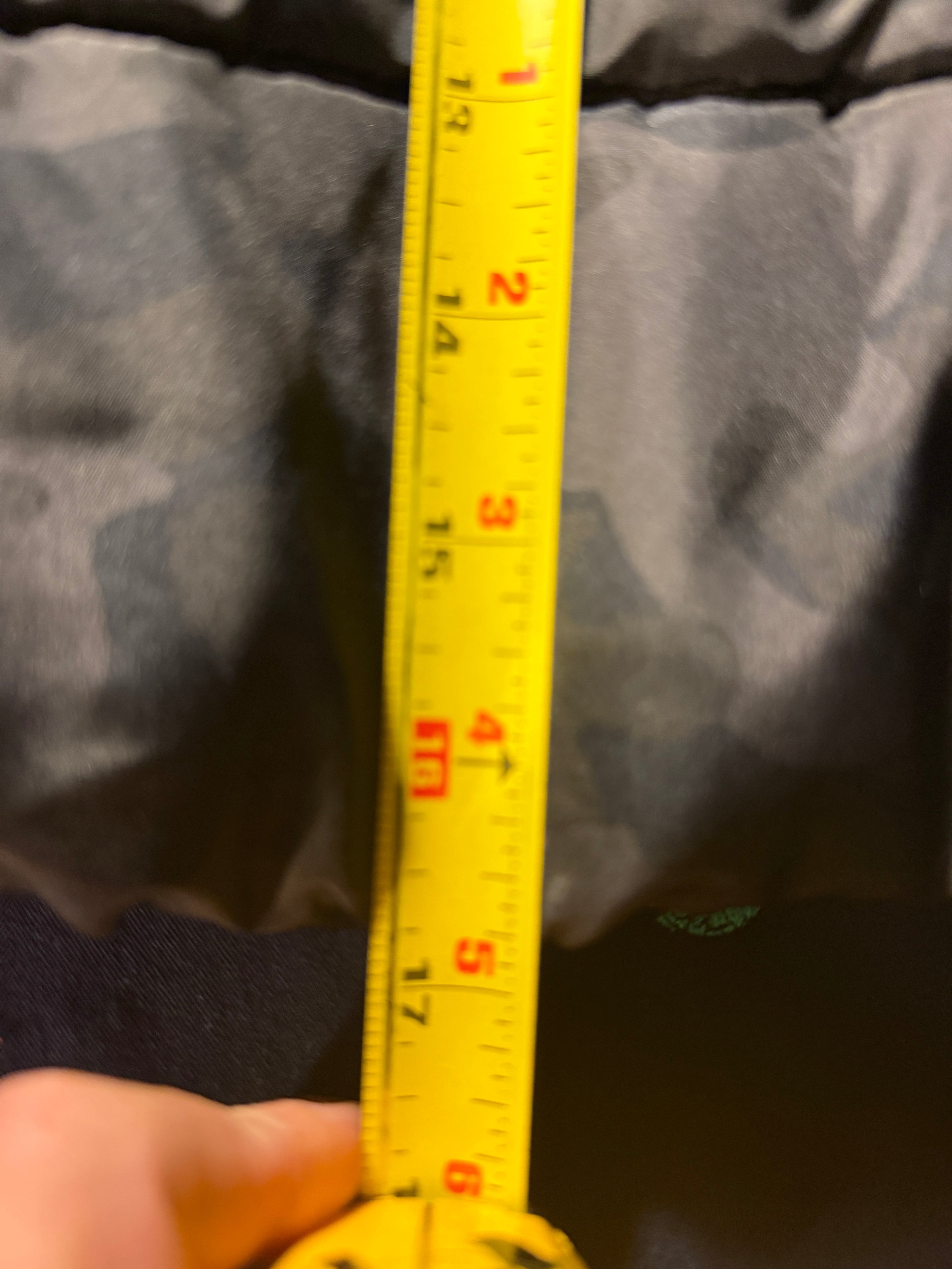 Tape measure showing vest width measurement