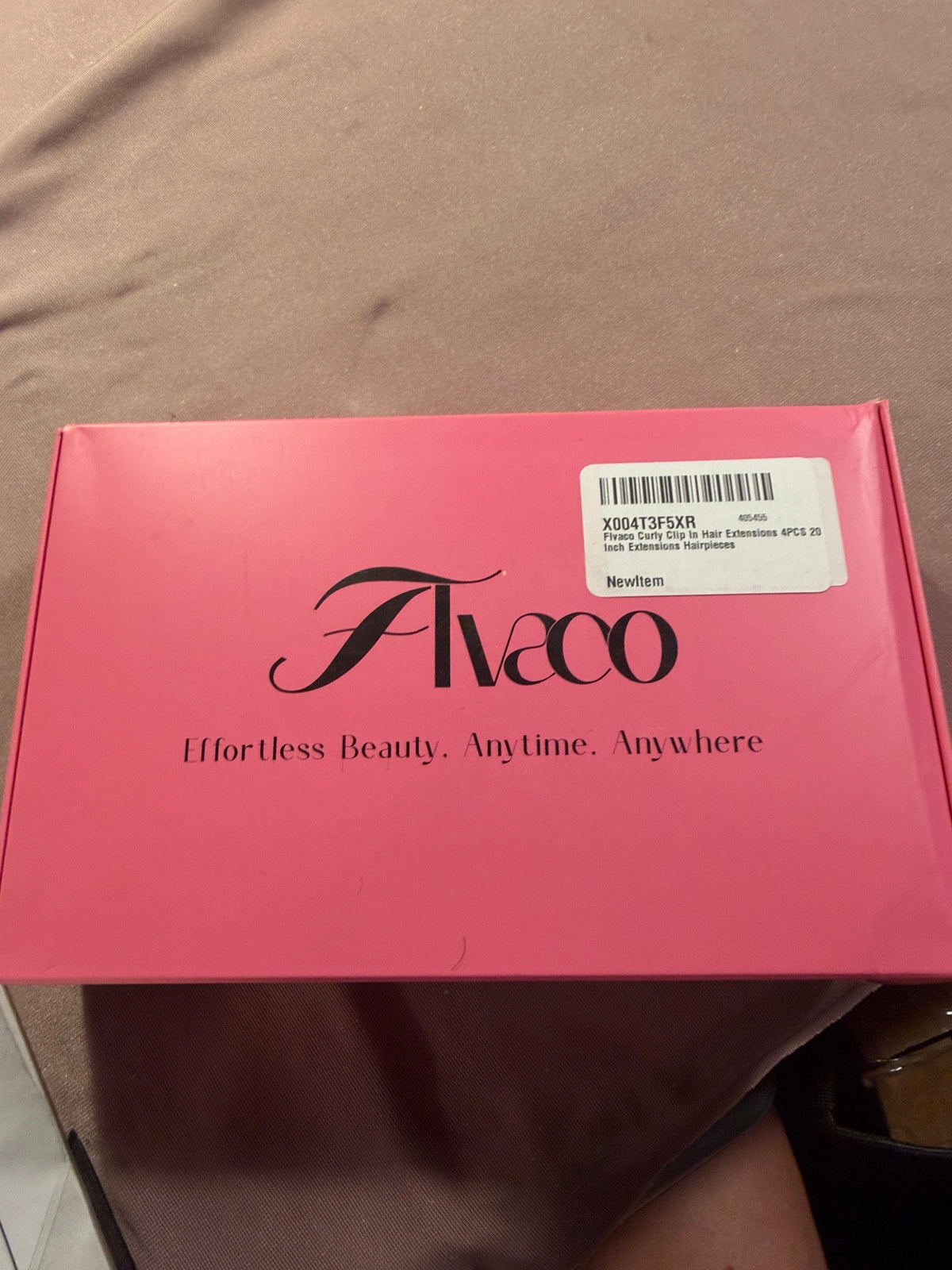 Pink Flvaco box showing curly clip-in hair extensions label