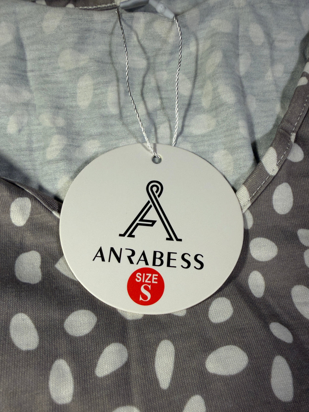 ANRABESS hangtag showing size S attached to the spotted dress